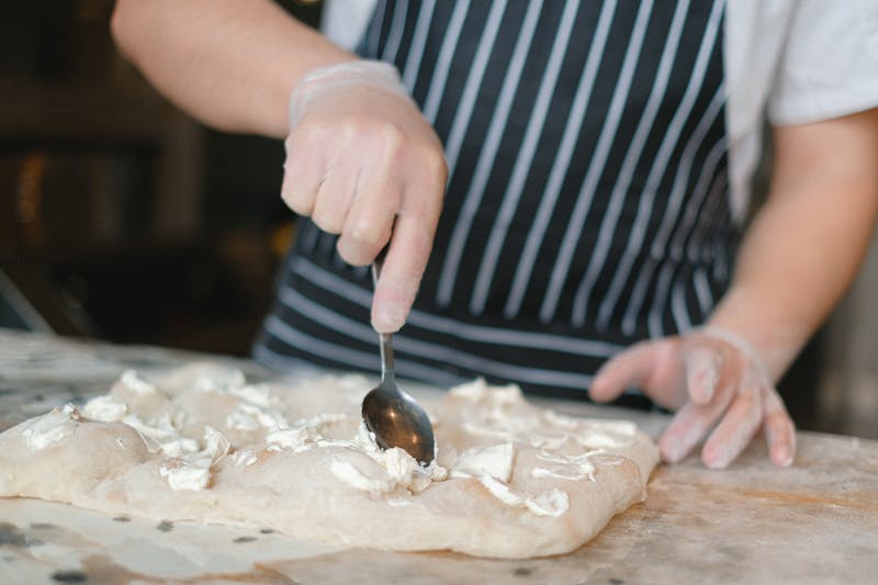 Fresh handcrafted pizza being prepared at Mod Pizza